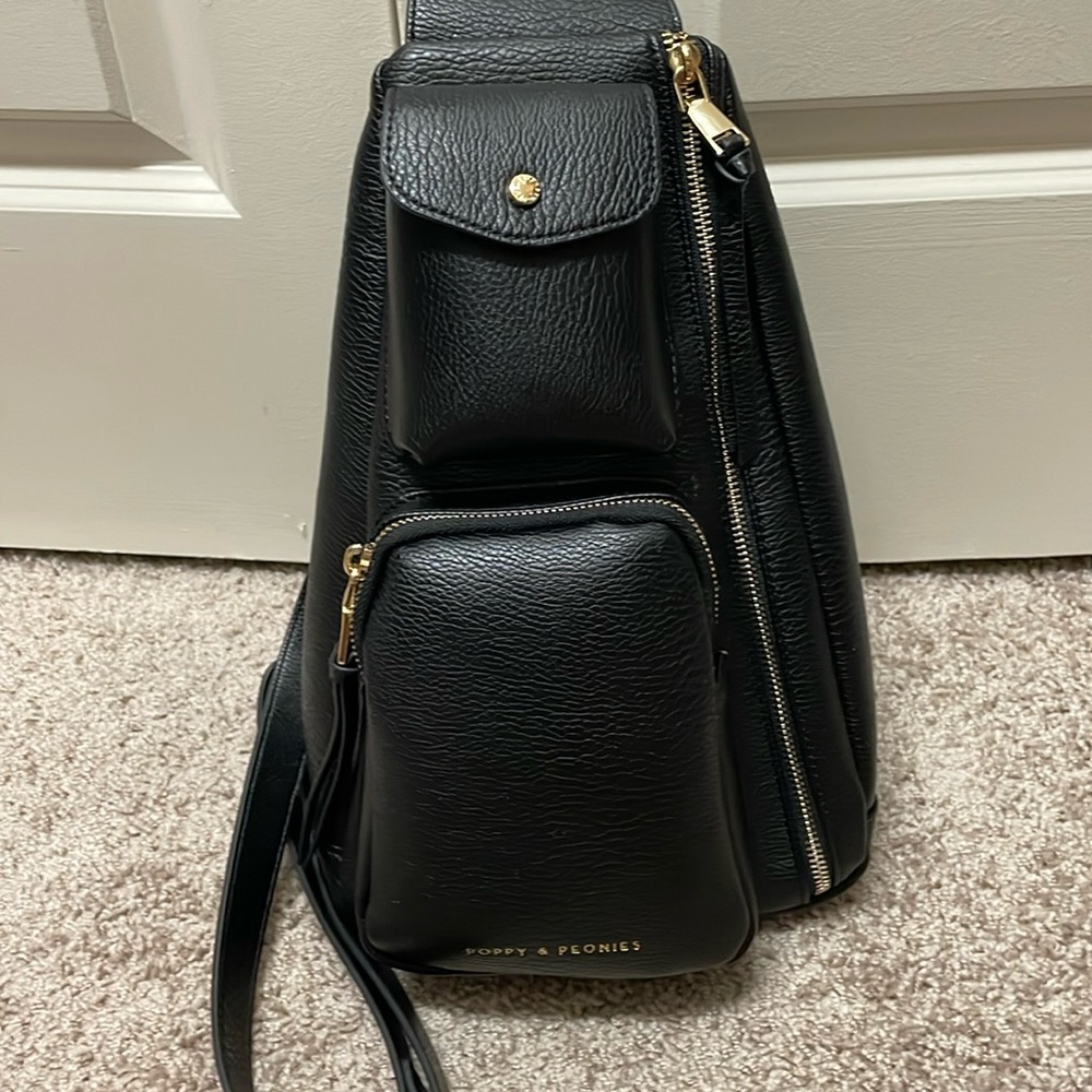 Poppy & Peonies En Route Sling Bag Black 
13.5"H x 7.5"W x 3"D